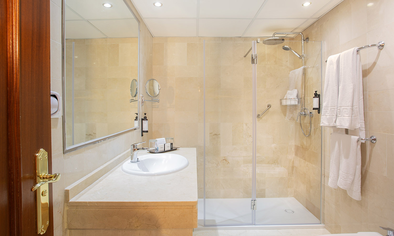 Bathroom with bath or walk-in shower and hairdryer